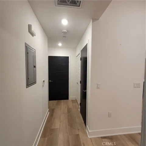 a bathroom with a sink mirror and toilet