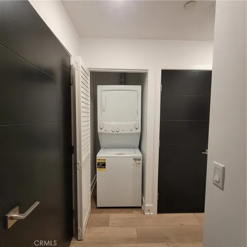 a view of a room with furniture and window