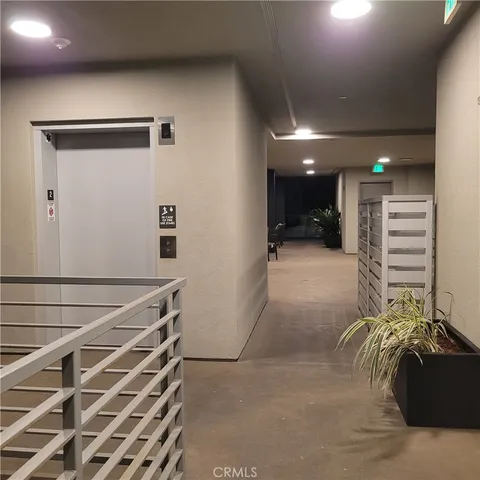 a view of an empty room with a staircase