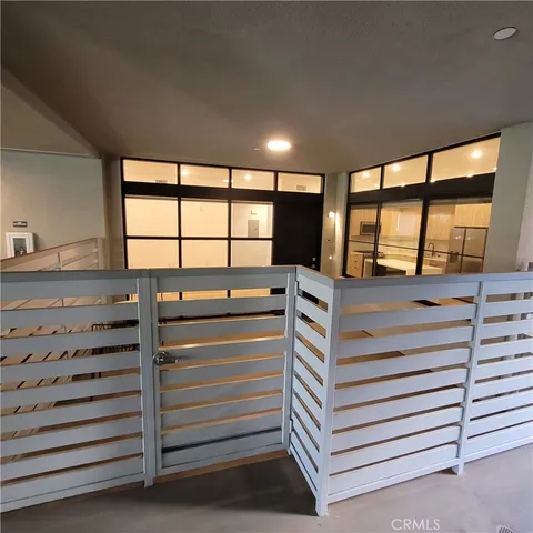 a lobby with furniture and stairs