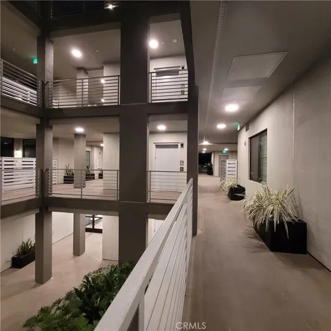a living room with furniture a table and a large mirror