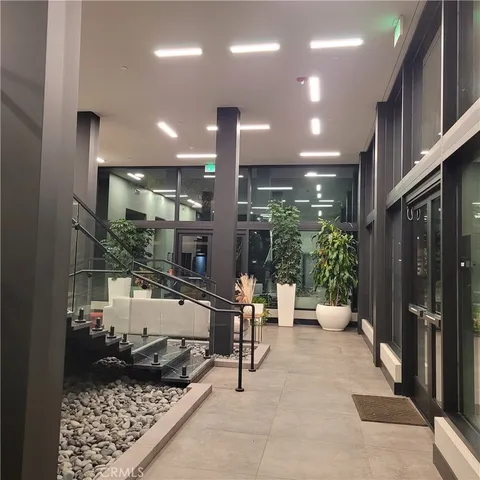 a view of parking garage with cars parked