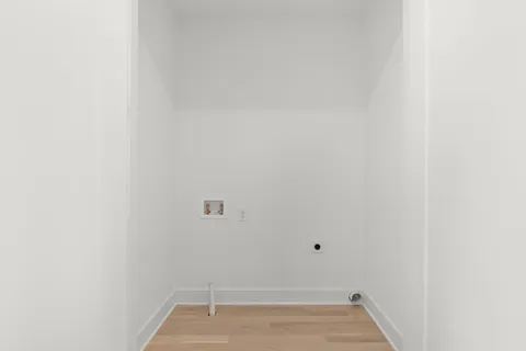 a kitchen with white cabinets and a sink