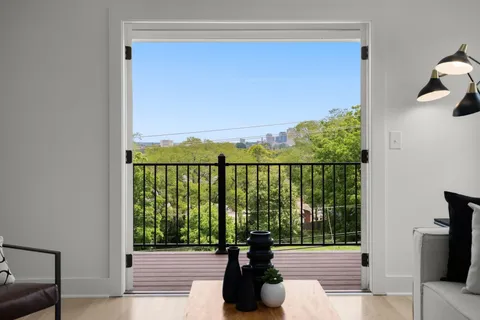 an aerial view of a house with outdoor space and street view