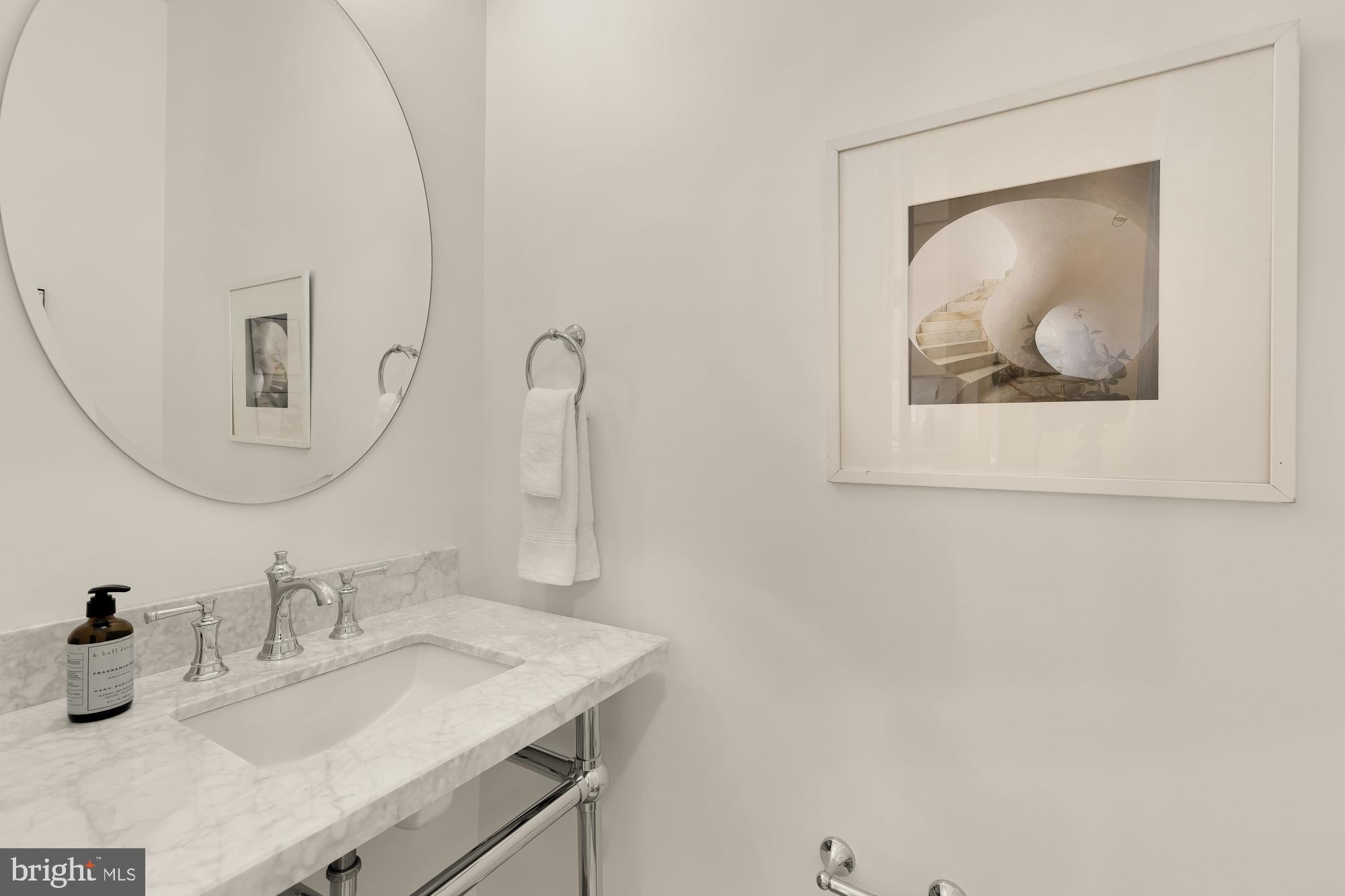 1932 11th Street Northwest Washington, DC 20001 - Photo 13 of 53 a bathroom with a sink and a mirror
