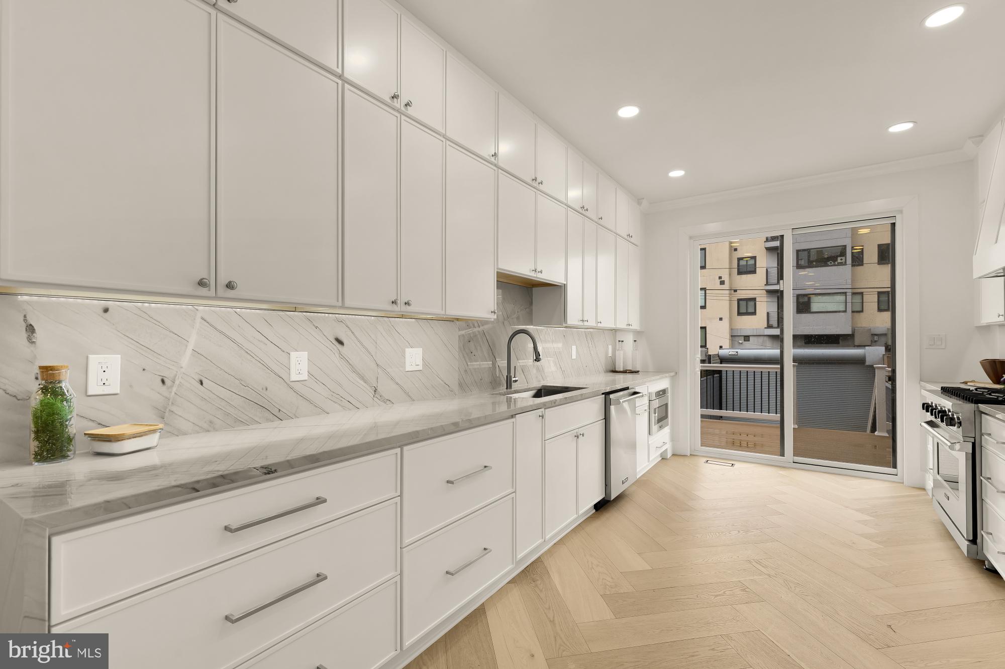 1932 11th Street Northwest Washington, DC 20001 - Photo 16 of 53 a large kitchen with cabinets