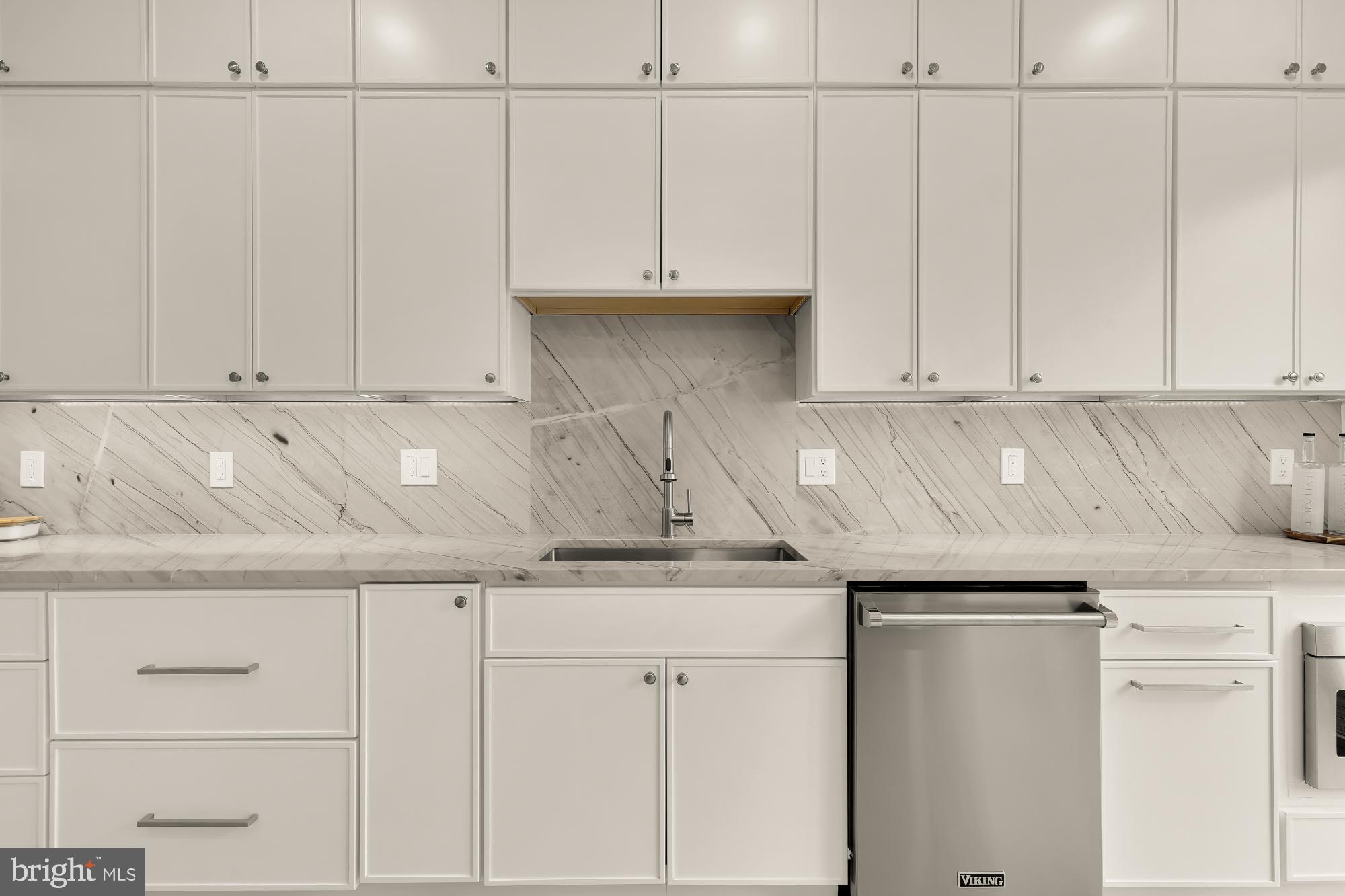 1932 11th Street Northwest Washington, DC 20001 - Photo 17 of 53 a kitchen with granite countertop white cabinets and a white stove