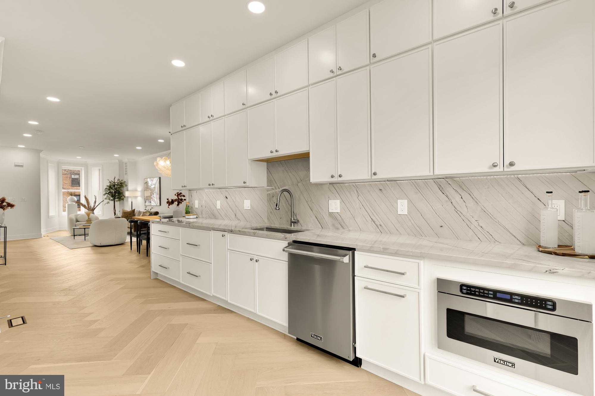 1932 11th Street Northwest Washington, DC 20001 - Photo 18 of 53 a kitchen with stainless steel appliances granite countertop a stove and white cabinets