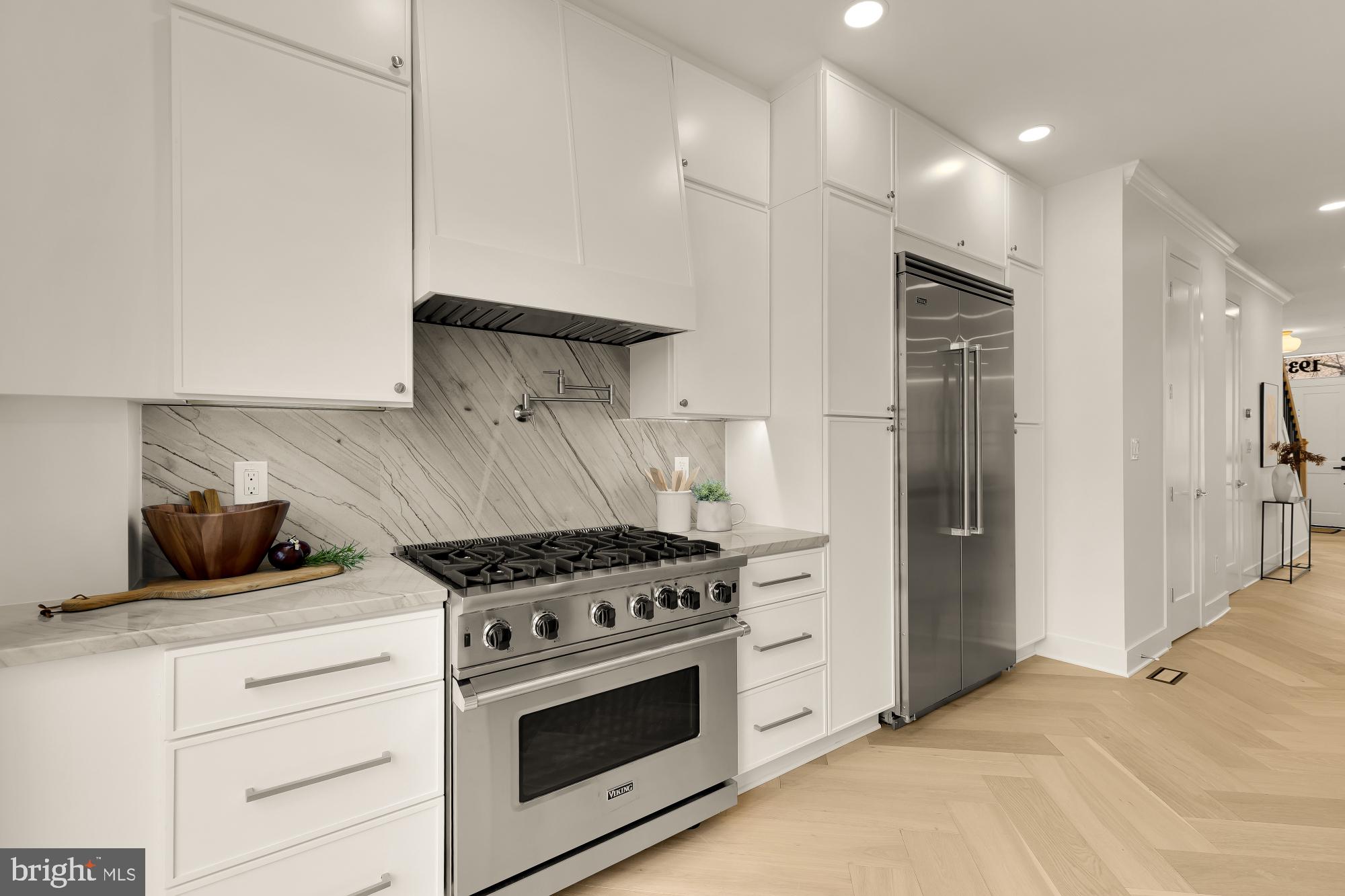 1932 11th Street Northwest Washington, DC 20001 - Photo 20 of 53 a kitchen with stainless steel appliances a stove and a refrigerator