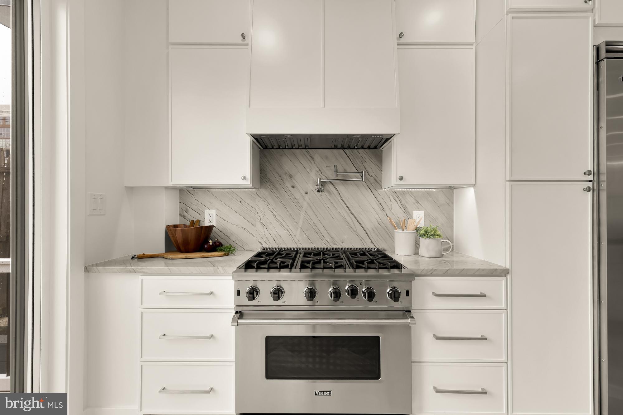 1932 11th Street Northwest Washington, DC 20001 - Photo 21 of 53 a stove top oven sitting inside of a kitchen