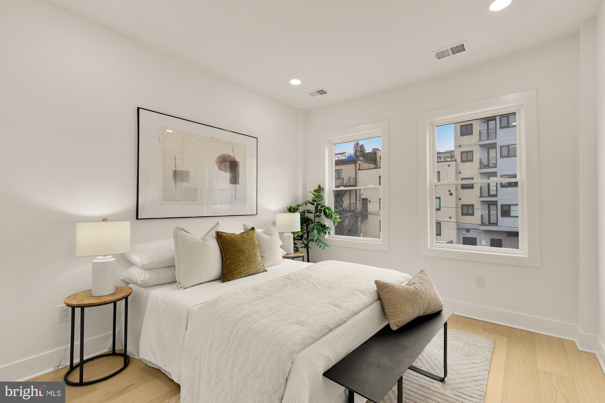 1932 11th Street Northwest Washington, DC 20001 - Photo 26 of 53 a bedroom with a bed and a potted plant