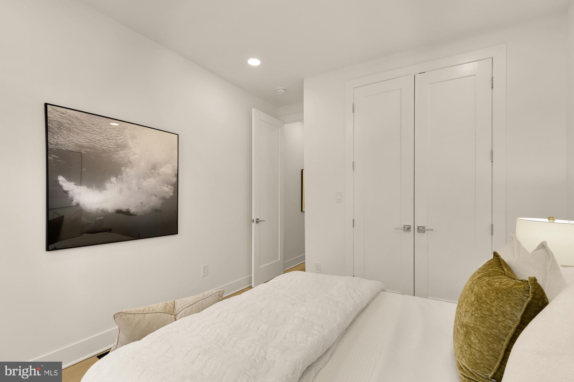 1932 11th Street Northwest Washington, DC 20001 - Photo 28 of 53 a bedroom with a bed and a painting on the wall