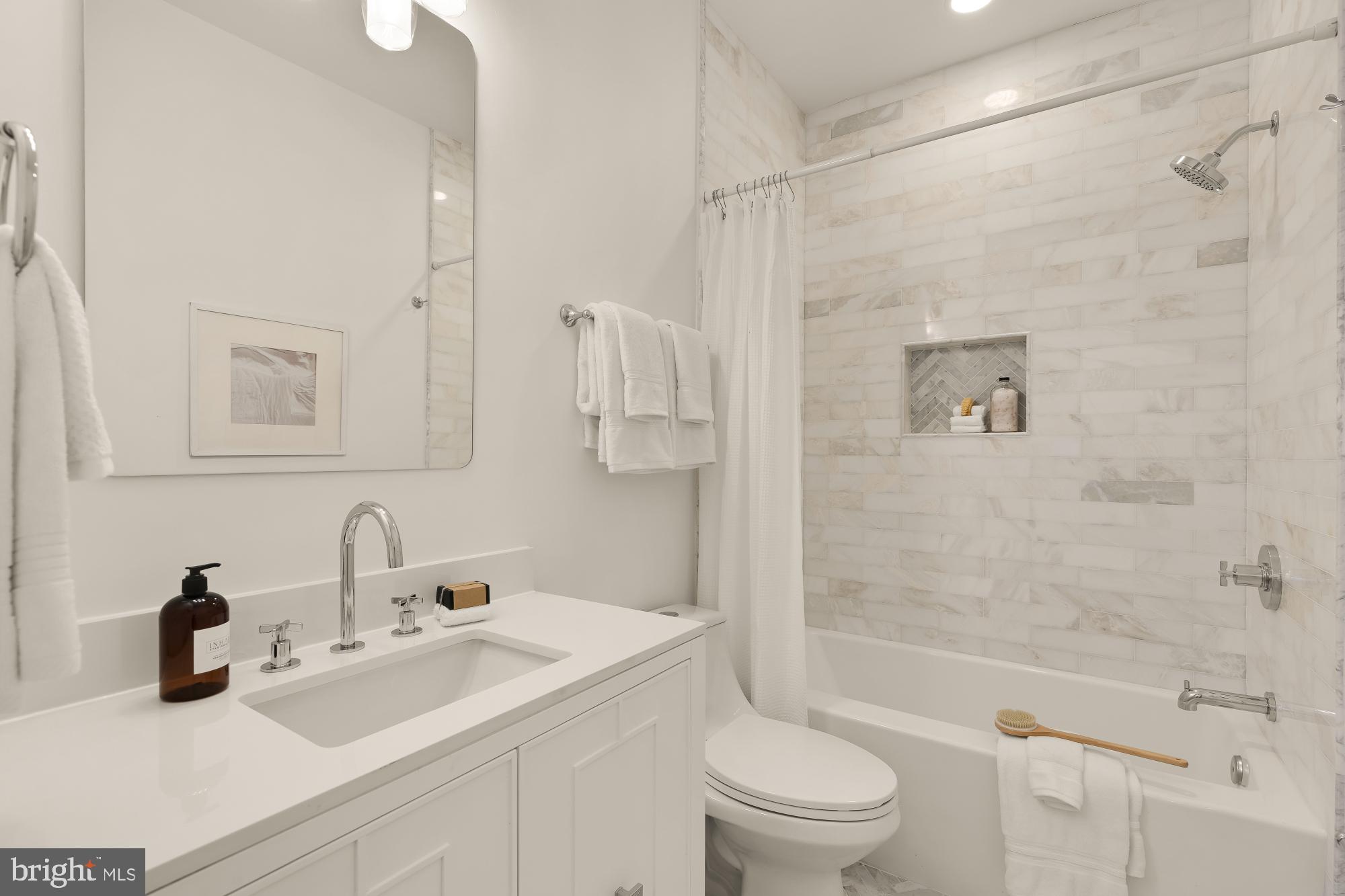 1932 11th Street Northwest Washington, DC 20001 - Photo 29 of 53 a bathroom with a sink toilet and shower