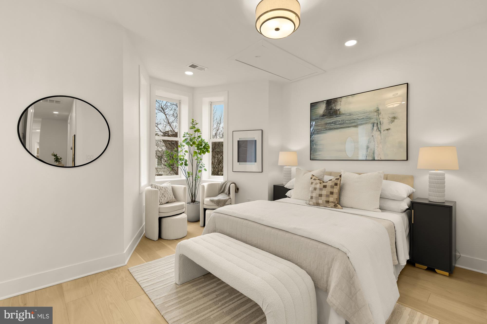 1932 11th Street Northwest Washington, DC 20001 - Photo 30 of 53 a bedroom with a large bed and a chandelier