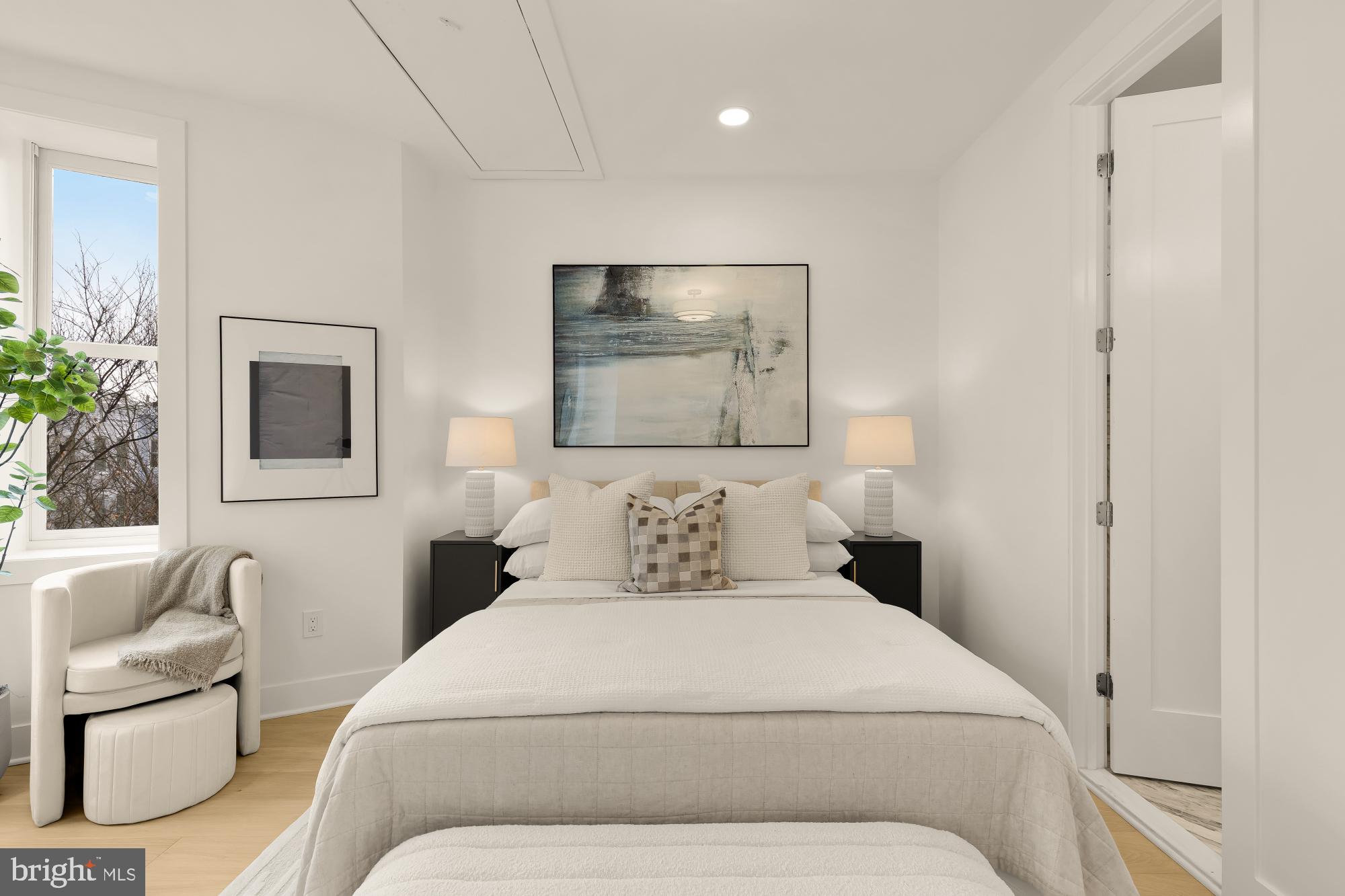 1932 11th Street Northwest Washington, DC 20001 - Photo 31 of 53 a bedroom with a bed and a couch