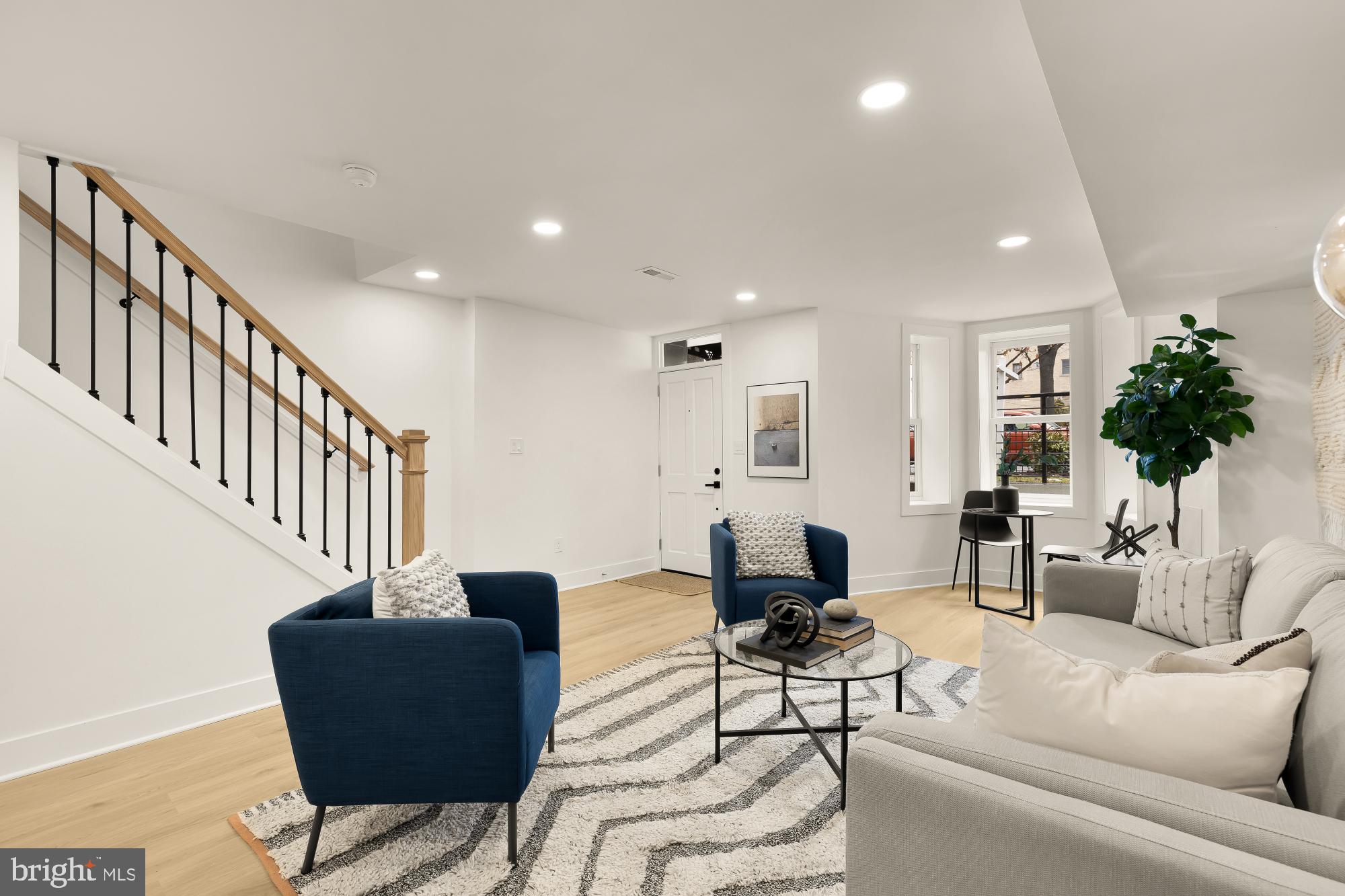 1932 11th Street Northwest Washington, DC 20001 - Photo 39 of 53 a living room with furniture and a couch