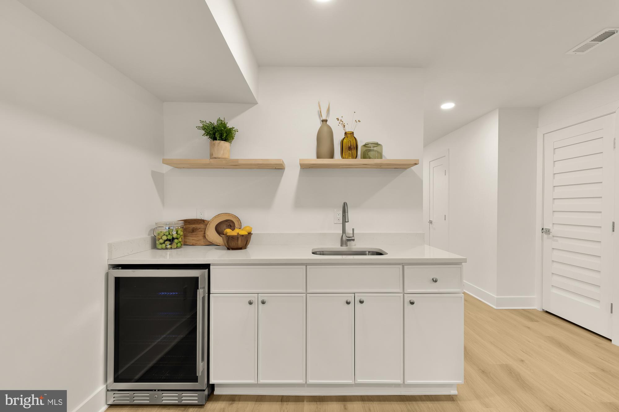 1932 11th Street Northwest Washington, DC 20001 - Photo 40 of 53 a kitchen with white cabinets and sink