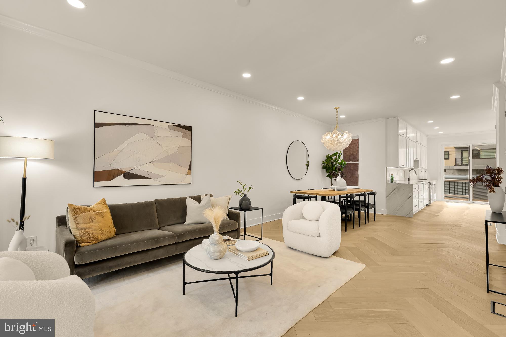 1932 11th Street Northwest Washington, DC 20001 - Photo 4 of 53 a living room with furniture and a dining table with kitchen view