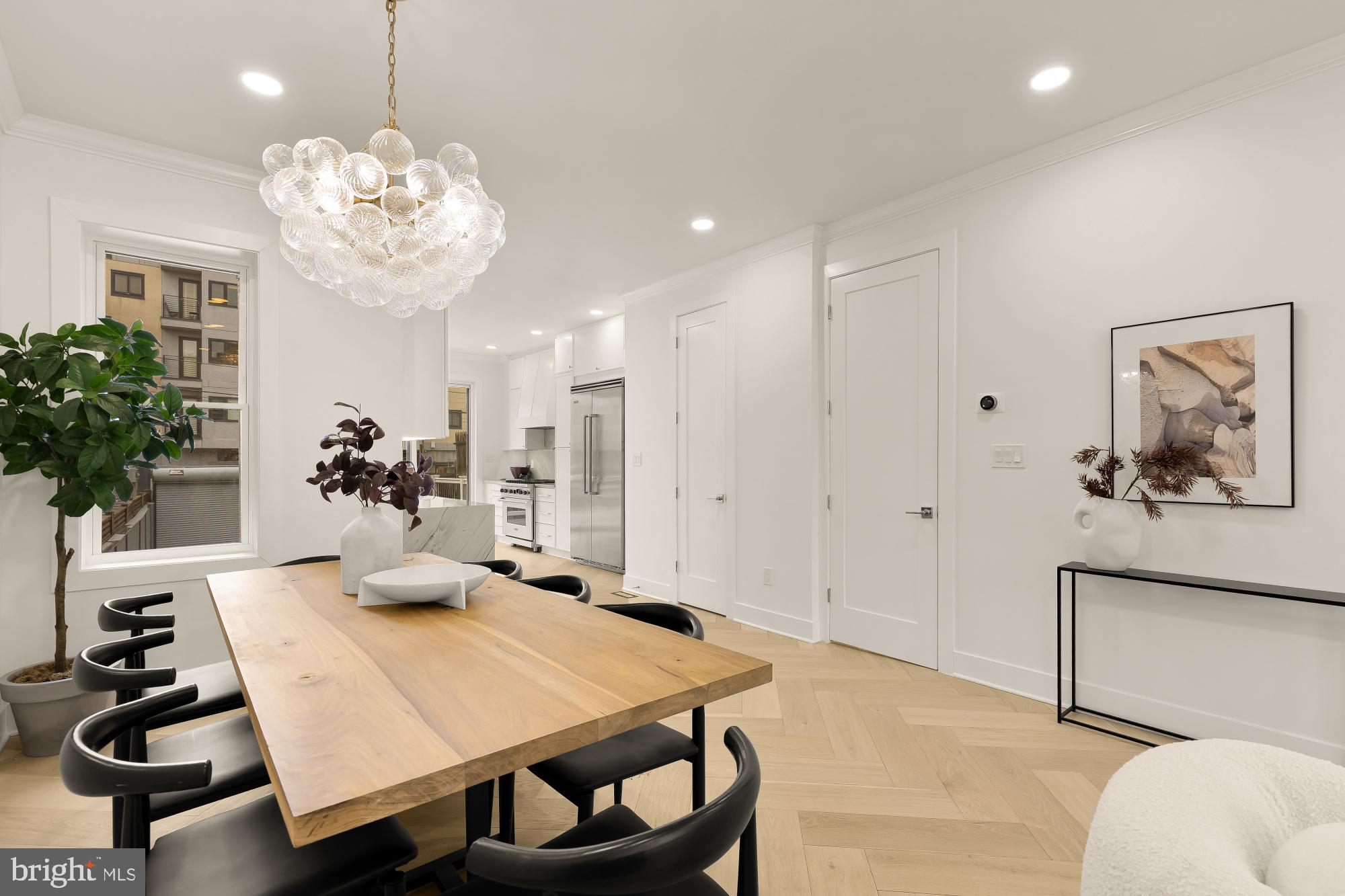 1932 11th Street Northwest Washington, DC 20001 - Photo 10 of 53 a view of a dining room with furniture and chandelier