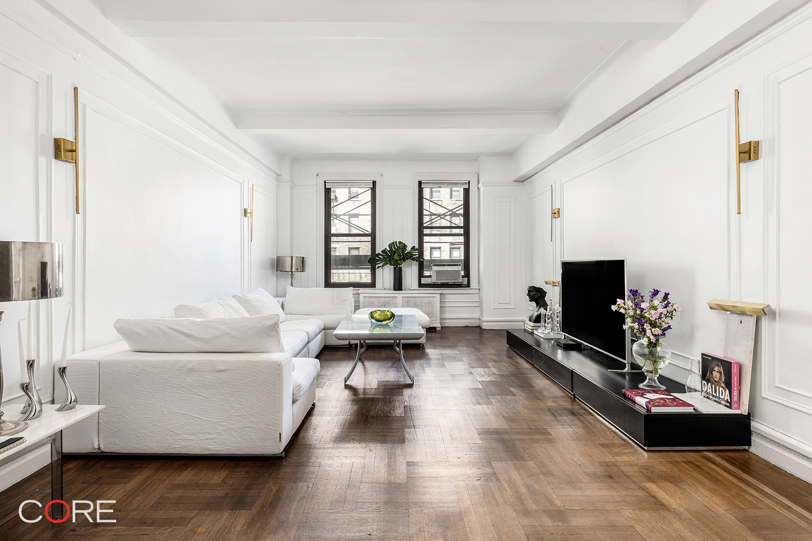 a living room with furniture and a flat screen tv