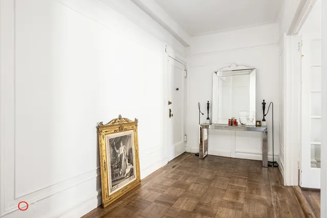 a storage room with wooden floor and washer