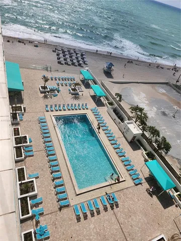 a large kitchen with a table and chairs