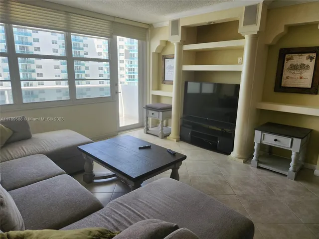 a living room with furniture and window