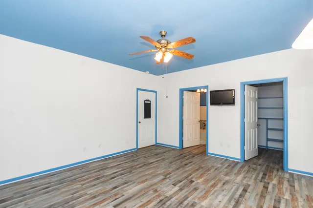 a view of a livingroom with wooden floor