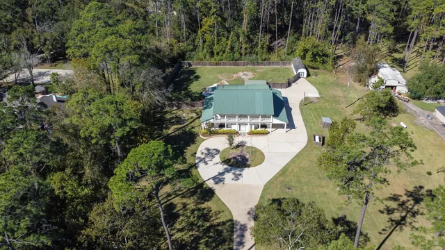 an aerial view of a house with outdoor space
