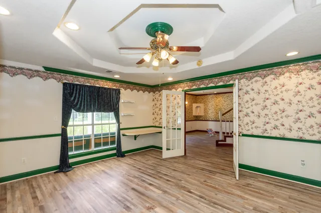 a view of a livingroom with furniture and a chandelier