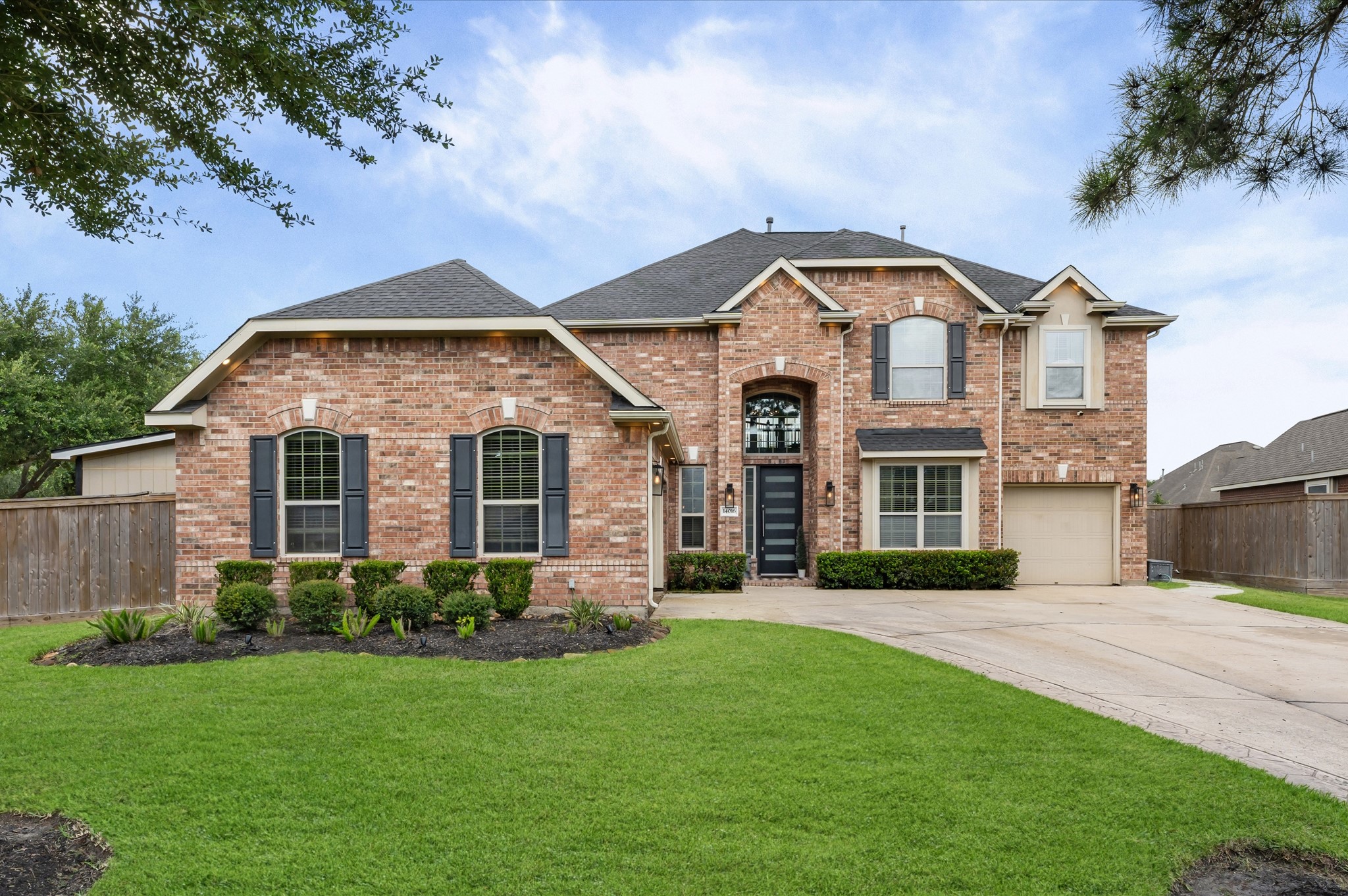 14016 Savannah Landing Lane Rosharon, TX 77583 - Photo 1 of 49 a front view of a house with a yard
