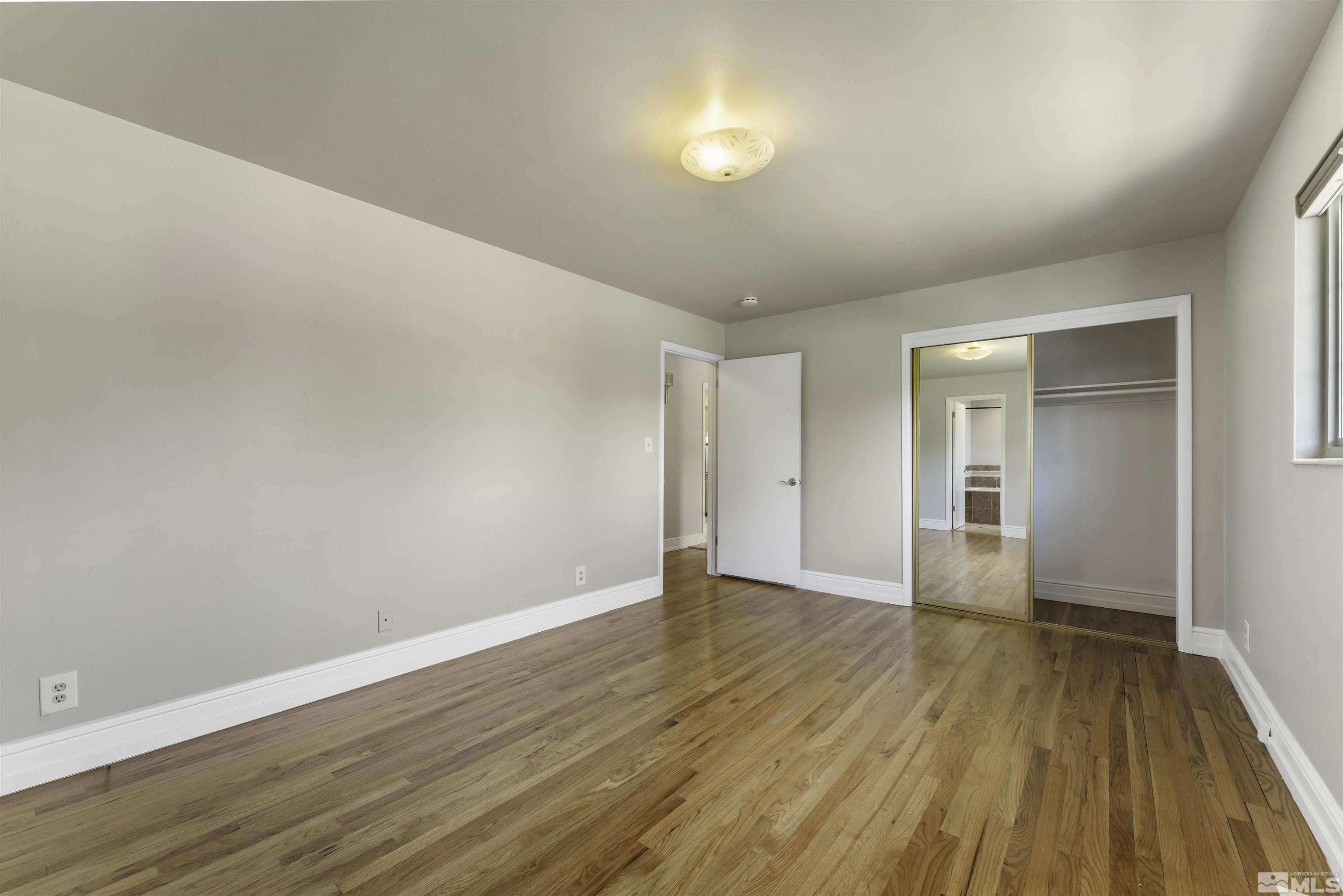 1401 Romero Way Reno, NV 89509 - Photo 17 of 28 a view of an empty room with wooden floor