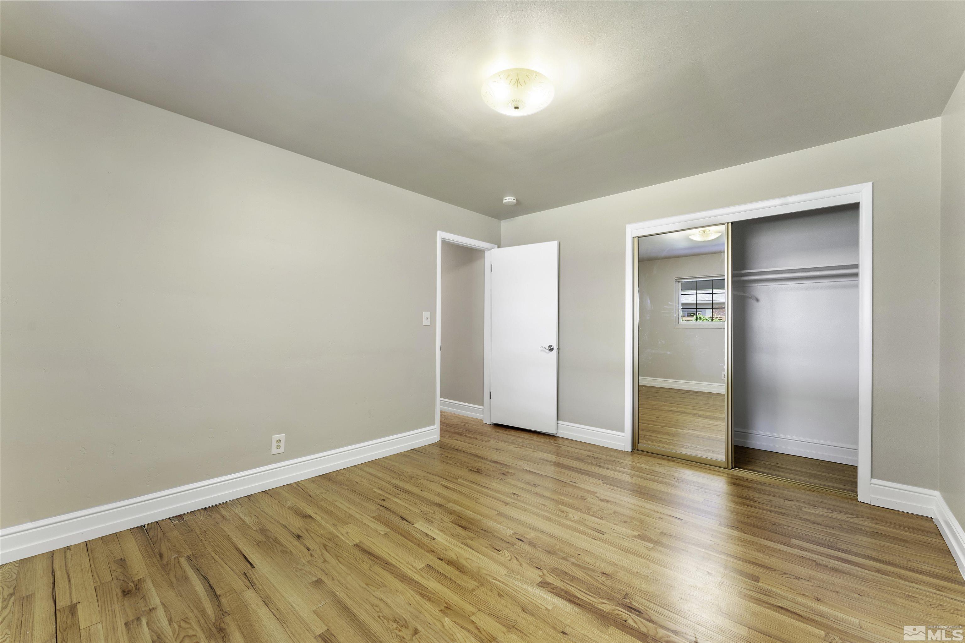 1401 Romero Way Reno, NV 89509 - Photo 20 of 28 a view of an empty room with wooden floor