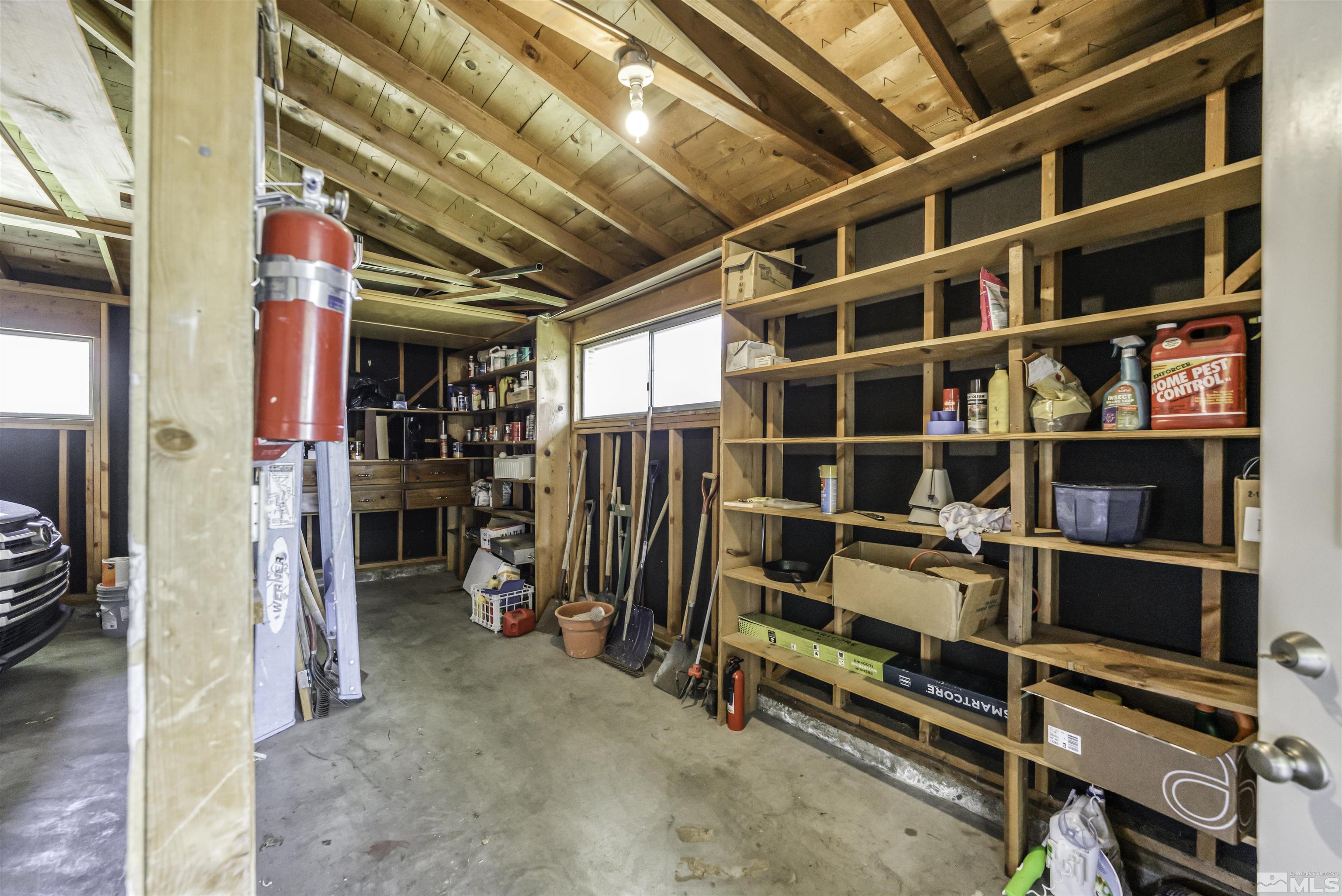 1401 Romero Way Reno, NV 89509 - Photo 23 of 28 a view of walk in closet with clothes and shoes