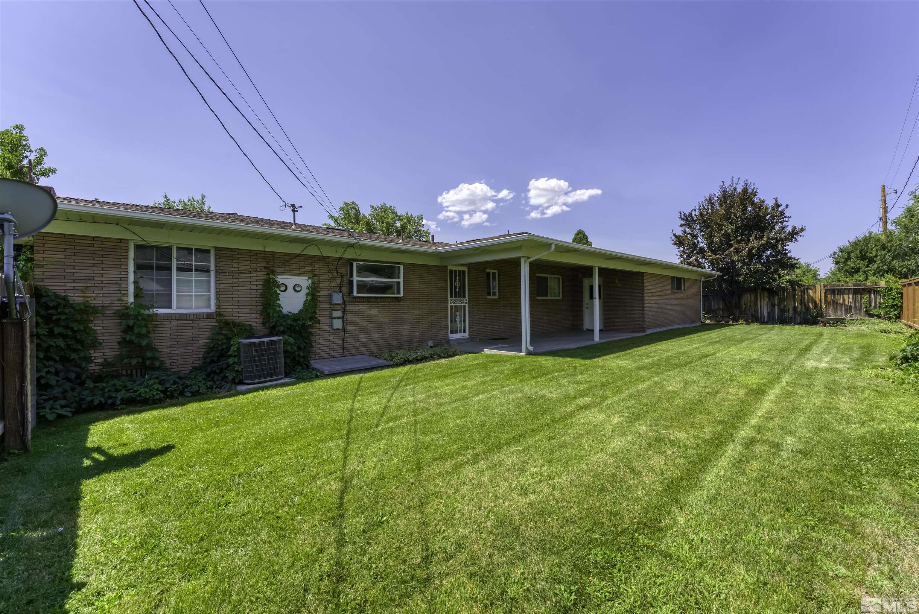 1401 Romero Way Reno, NV 89509 - Photo 26 of 28 a view of a house with a yard