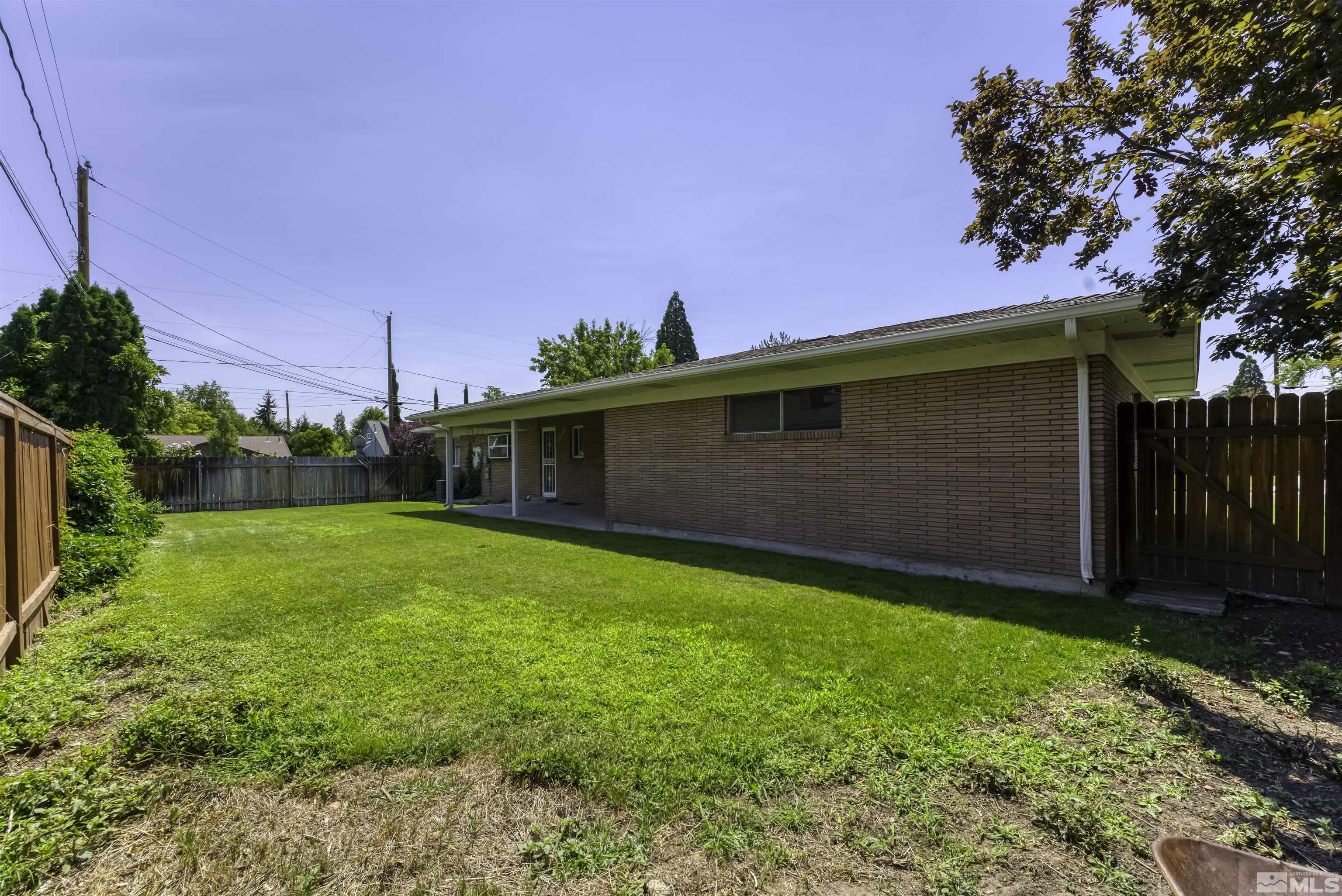 1401 Romero Way Reno, NV 89509 - Photo 27 of 28 a backyard of a house with lots of green space