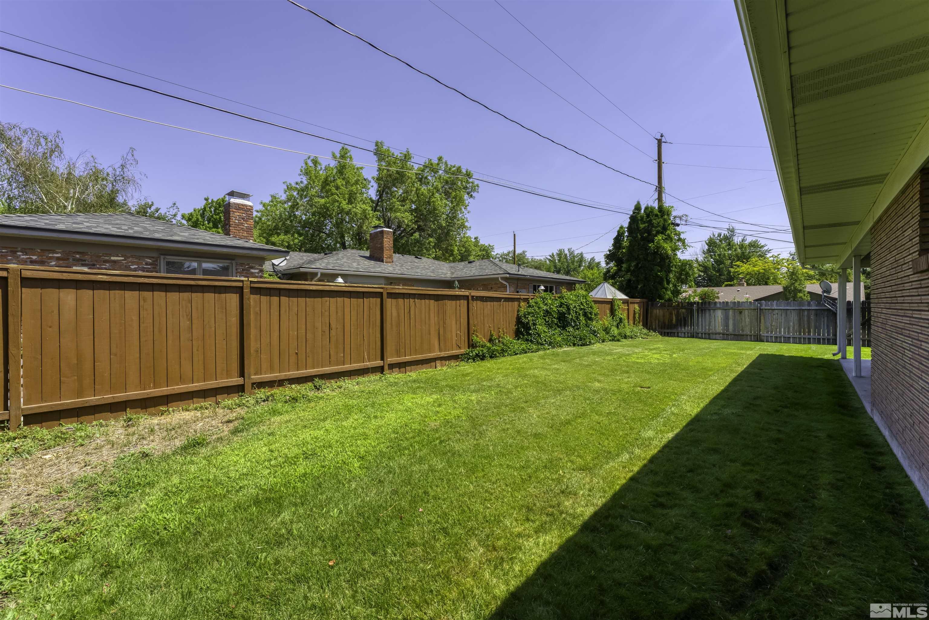 1401 Romero Way Reno, NV 89509 - Photo 28 of 28 a view of a backyard with potted plants and floor to ceiling window