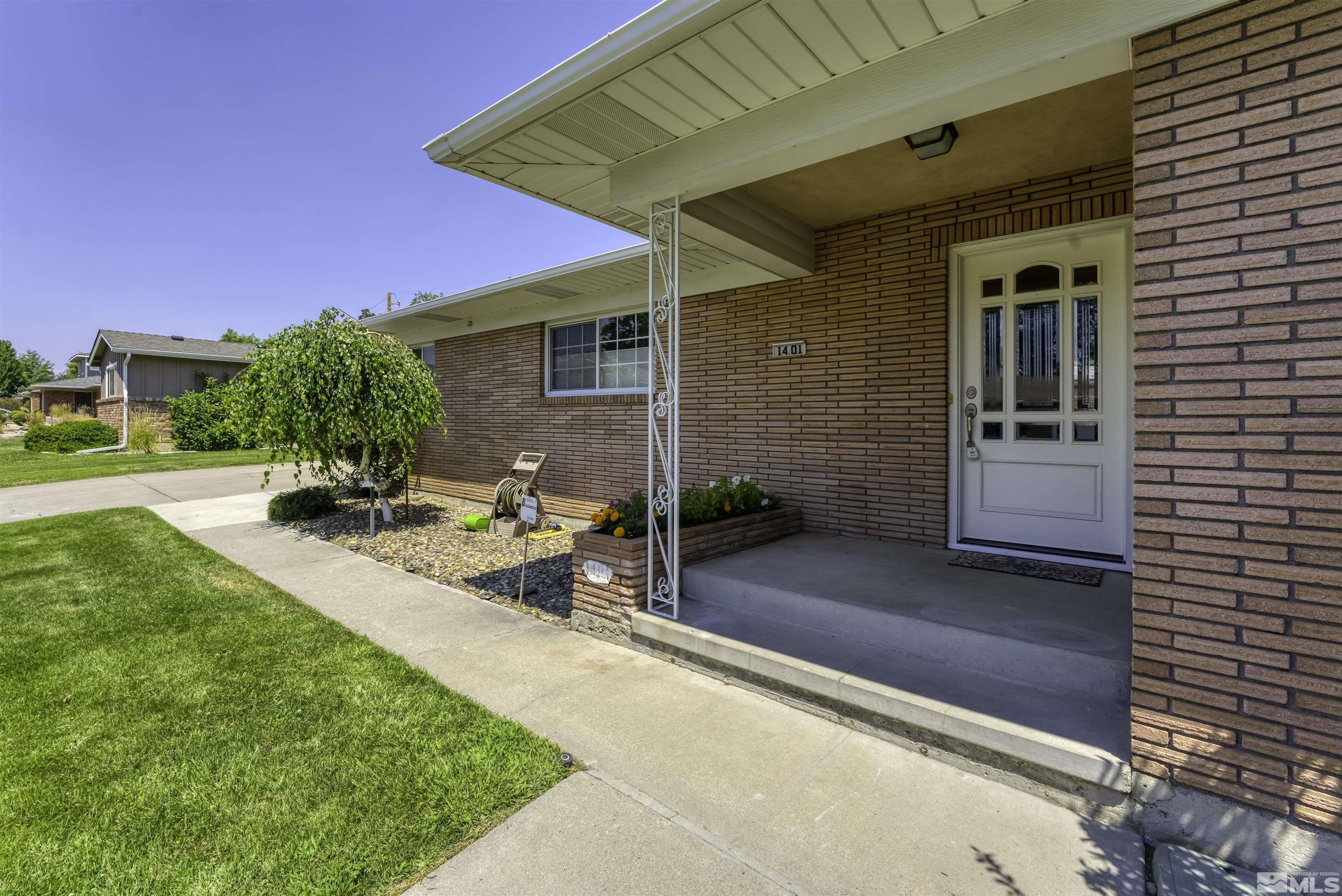 1401 Romero Way Reno, NV 89509 - Photo 5 of 28 a view of a patio with table and chairs and potted plants