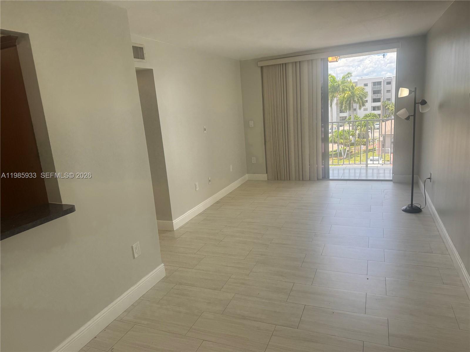 8075 Northwest 7th Street, Unit 403 Miami, FL 33126 - Photo 15 of 29 an empty room with windows