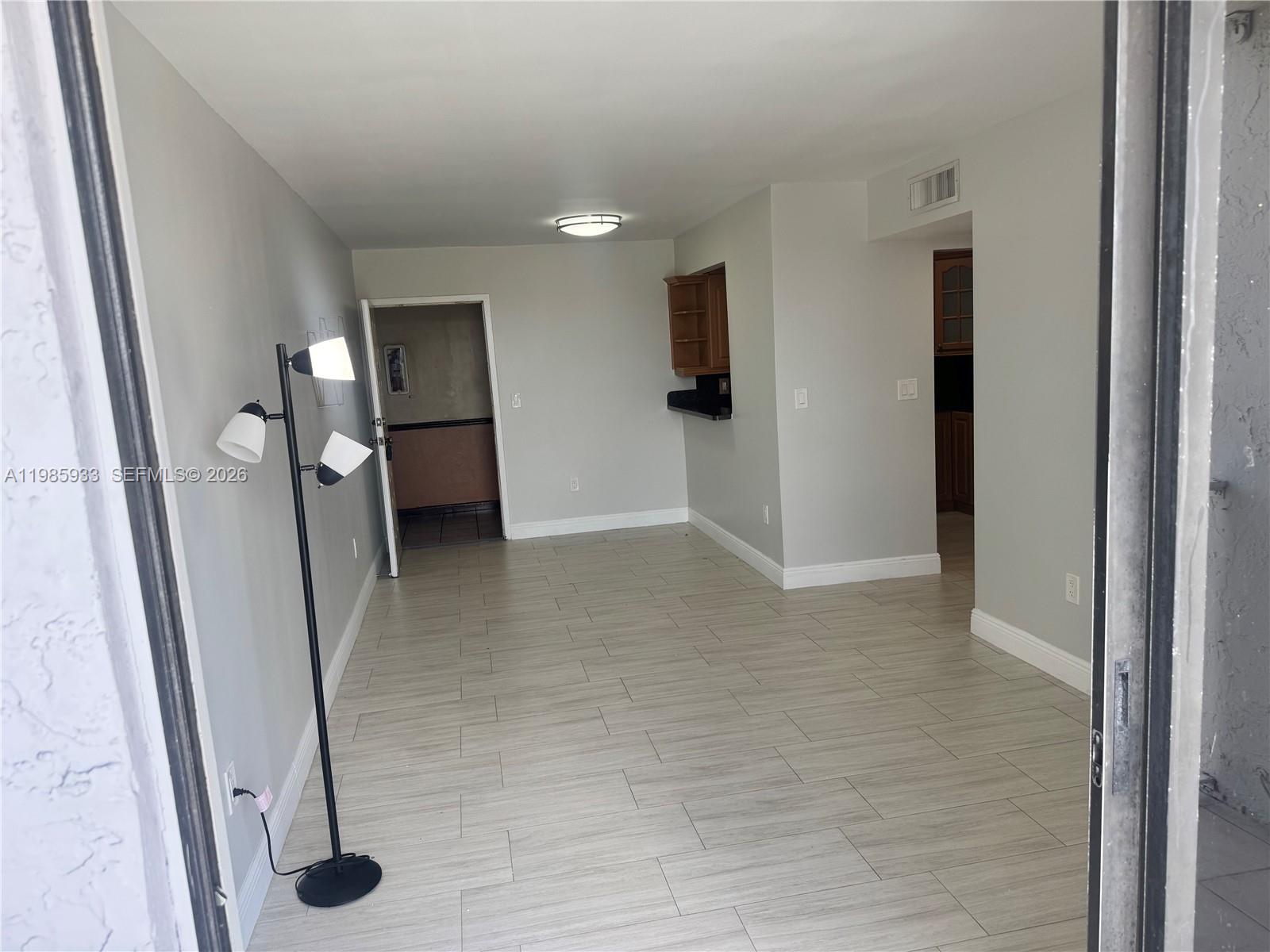 8075 Northwest 7th Street, Unit 403 Miami, FL 33126 - Photo 16 of 29 wooden floor in a hall with an entryway