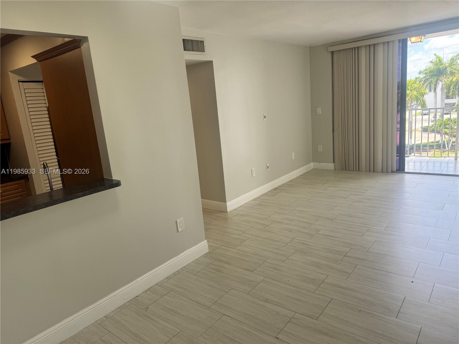 8075 Northwest 7th Street, Unit 403 Miami, FL 33126 - Photo 17 of 29 an empty room with windows