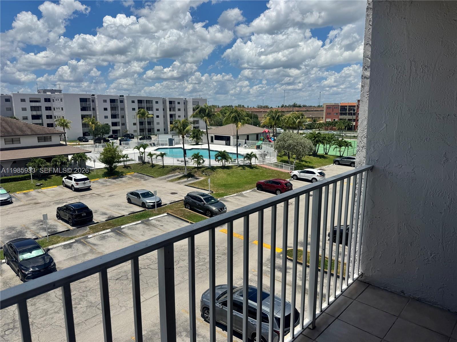 8075 Northwest 7th Street, Unit 403 Miami, FL 33126 - Photo 28 of 29 a view of swimming pool from balcony