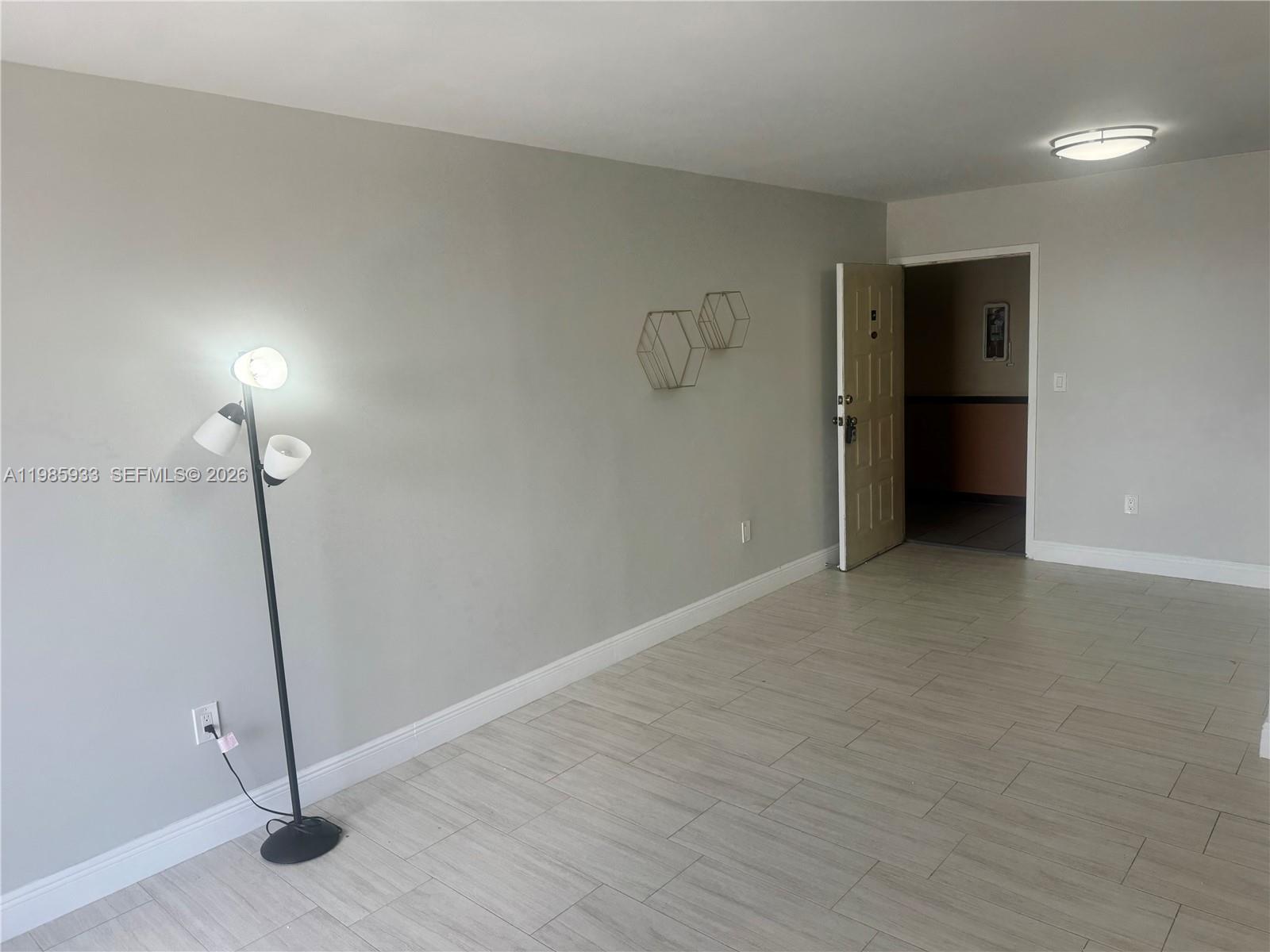 8075 Northwest 7th Street, Unit 403 Miami, FL 33126 - Photo 5 of 29 a view of an empty room