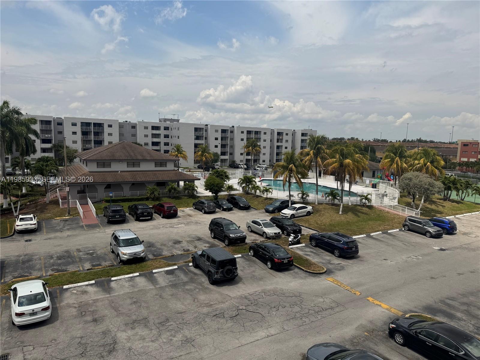 8075 Northwest 7th Street, Unit 403 Miami, FL 33126 - Photo 10 of 29 a view of a parking area