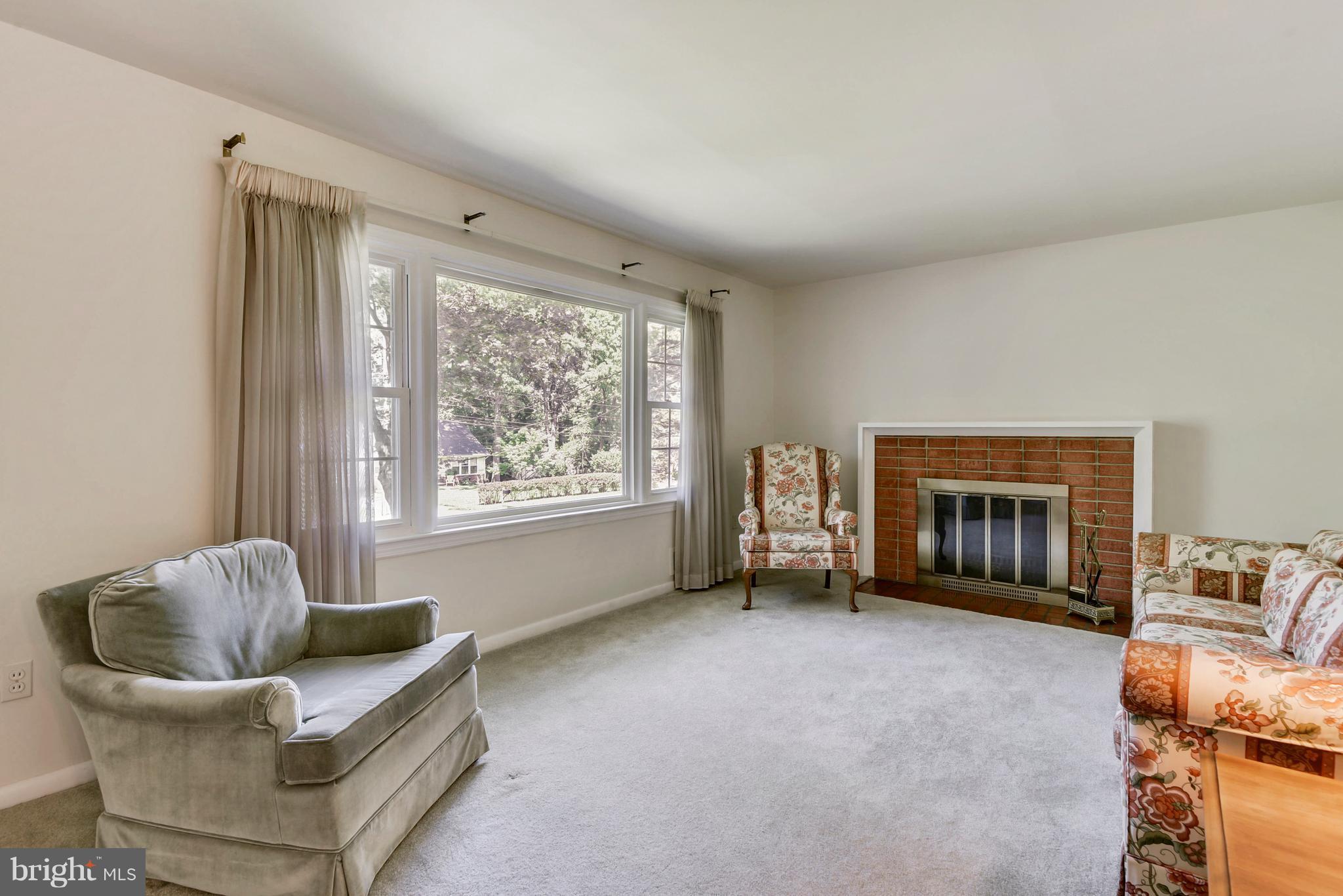 6005 Windham Road Laurel, MD 20707 - Photo 6 of 20 Living Room w/ Wood Burning Fireplace