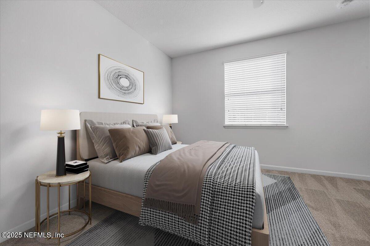 102 Anguilla Boulevard St. Augustine, FL 32092 - Photo 11 of 24 a bedroom with a bed and painting on the wall