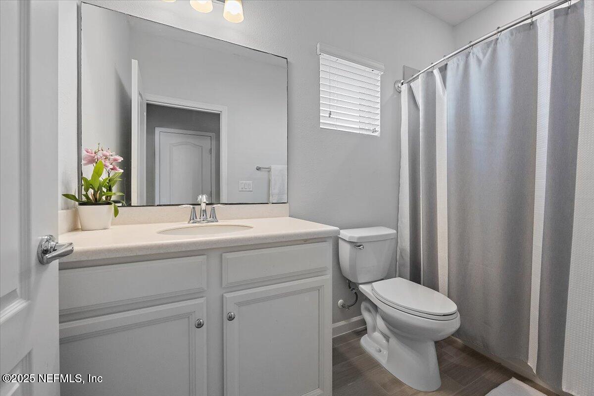 102 Anguilla Boulevard St. Augustine, FL 32092 - Photo 14 of 24 a bathroom with a sink a toilet and shower
