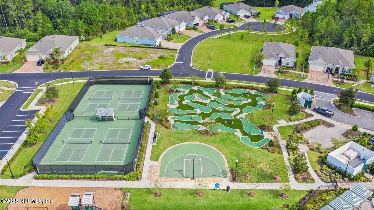 102 Anguilla Boulevard St. Augustine, FL 32092 - Photo 22 of 24 a view of swimming pool with a garden and plants