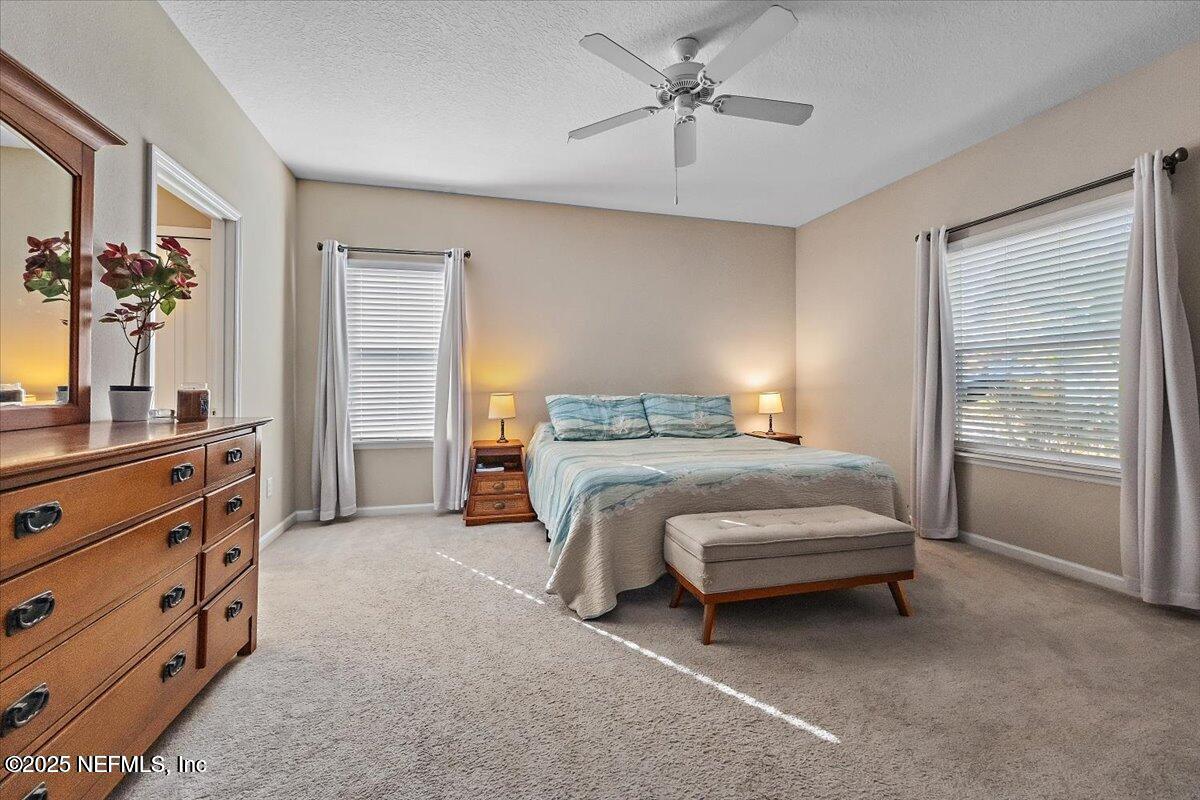 102 Anguilla Boulevard St. Augustine, FL 32092 - Photo 9 of 24 a bedroom with a bed and a dresser