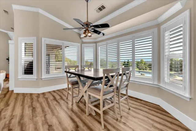 a view of a dining room with furniture window and wooden floor
